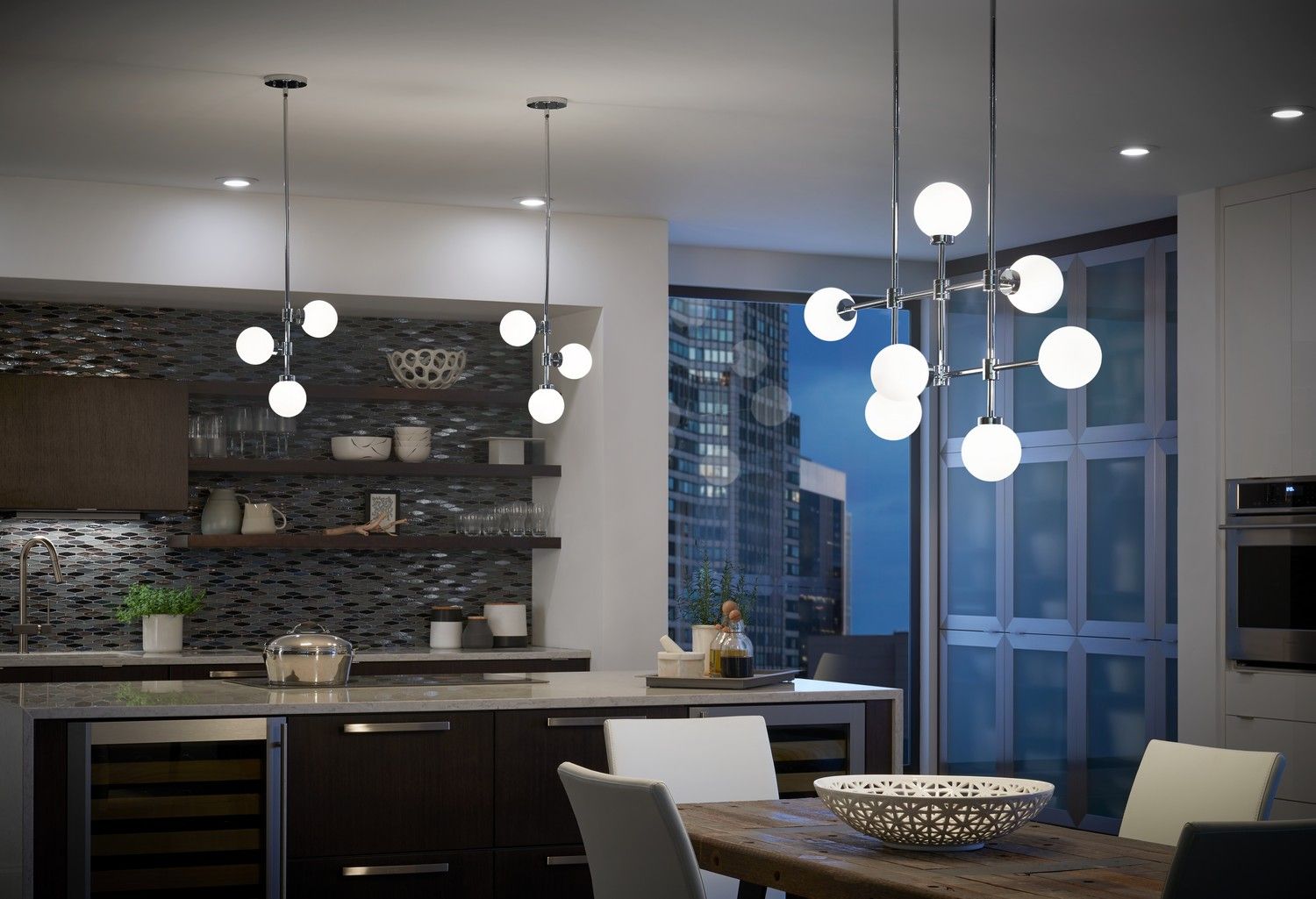 Modern kitchen and dining area with pendant lights, dark cabinetry, and large windows overlooking a city view