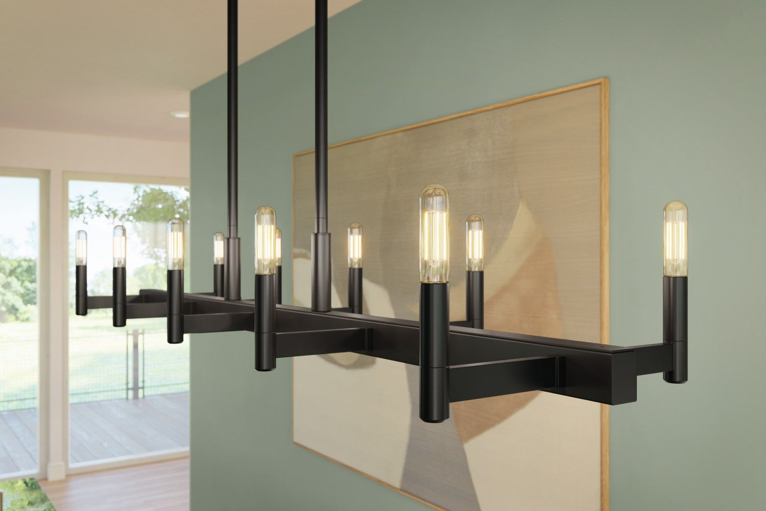Modern black chandelier with candle-style bulbs hanging in a bright room near a large wall art piece