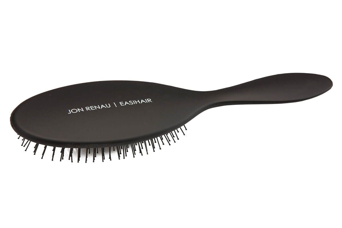 A black hair brush with a long handle on a white background
