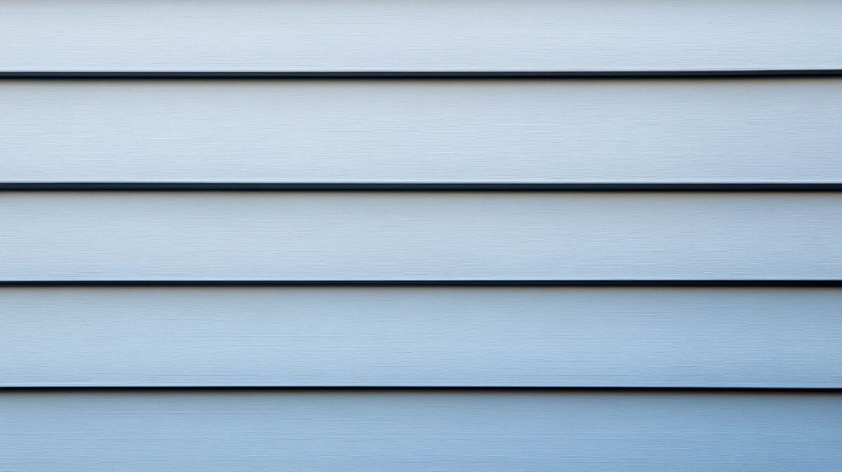 Light blue horizontal wooden siding with subtle texture and shadowed seams