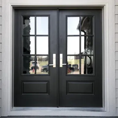 Black double front doors with glass panes and white trim on a house exterior