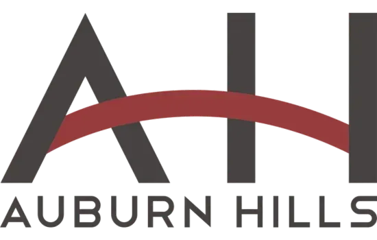 Auburn Hills logo with dark gray letters and a red arc over the text