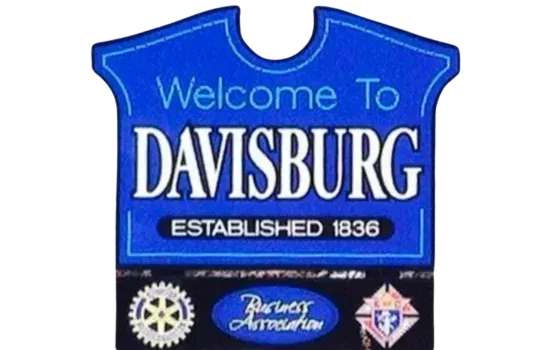 Blue welcome sign reading “Welcome to Davisburg” with “Established 1836.”