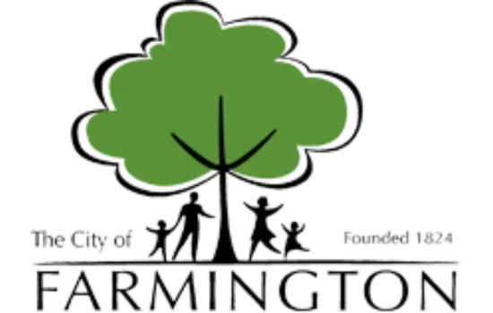 City of Farmington logo with green tree and black silhouettes,