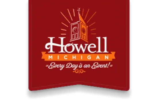 Red Howell, Michigan banner with white script and a church steeple icon; “Every Day is a Great…” slogan