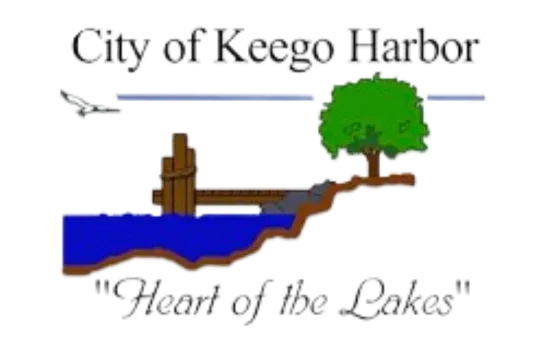 City of Keego Harbor logo with blue lake, dock, tree, and “Heart of the Lakes” text