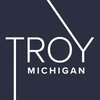 Troy, Michigan logo in white text on a dark blue background