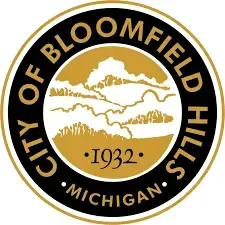 City of Bloomfield Hills, Michigan seal with gold and black circular design and “1932” in the center