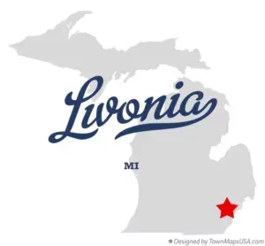 Grey map of Michigan with blue “Livonia” script and red star marking the city location
