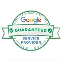 A Google Guaranteed service provider badge featuring a green circular border, a banner, and two checkmarks.