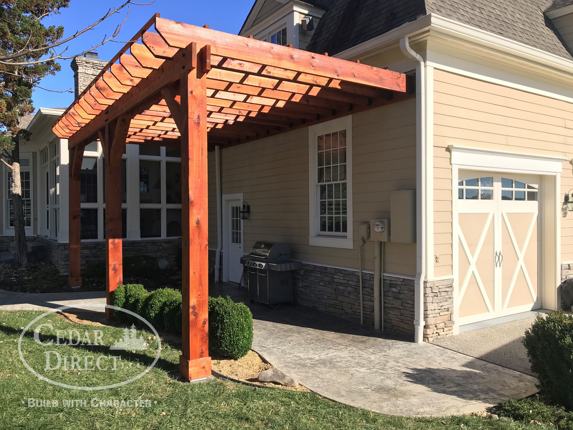 A house with a pergola on the side of it