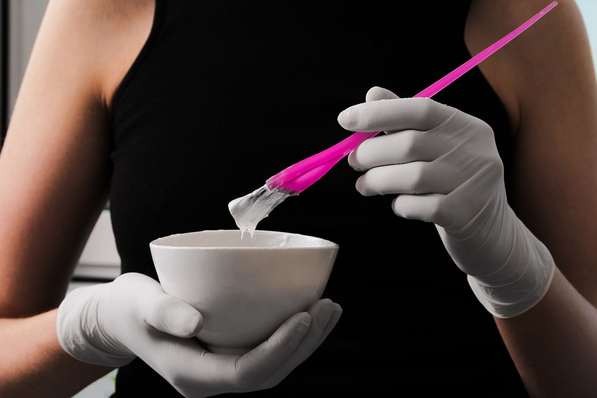 Woman Holding a Bowl and Brush for Hair Color