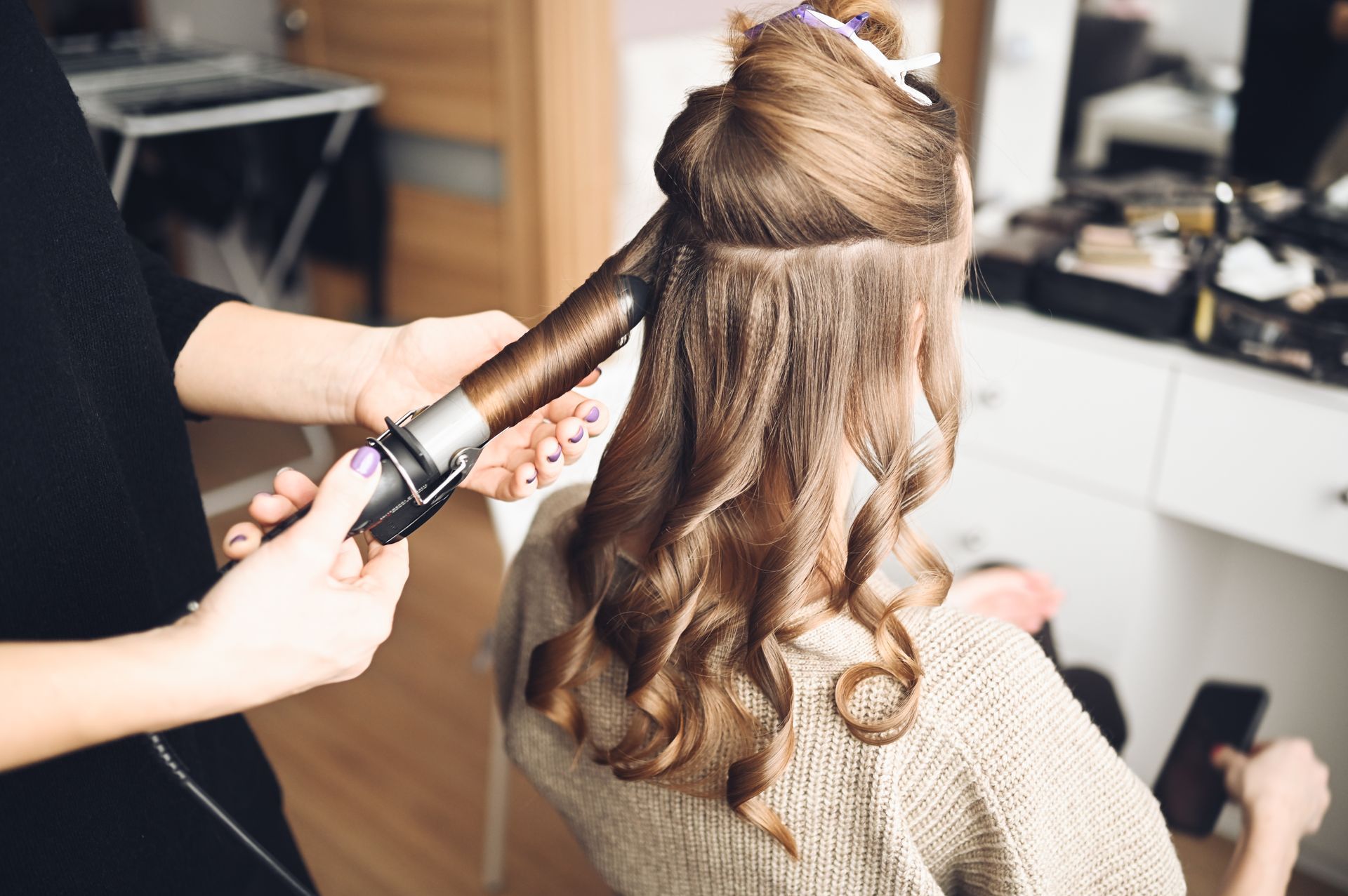 Woman Having Her Hair Curl