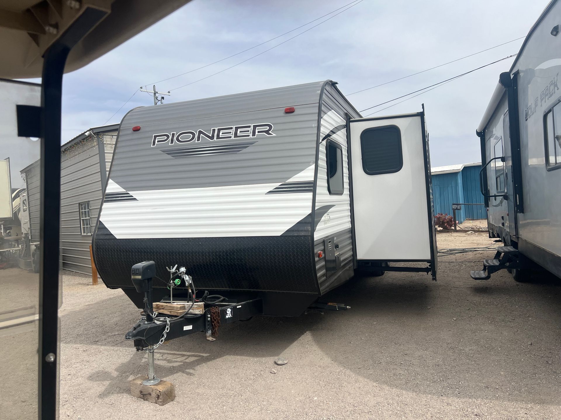 A white flagstaff classic rv is parked in a parking lot