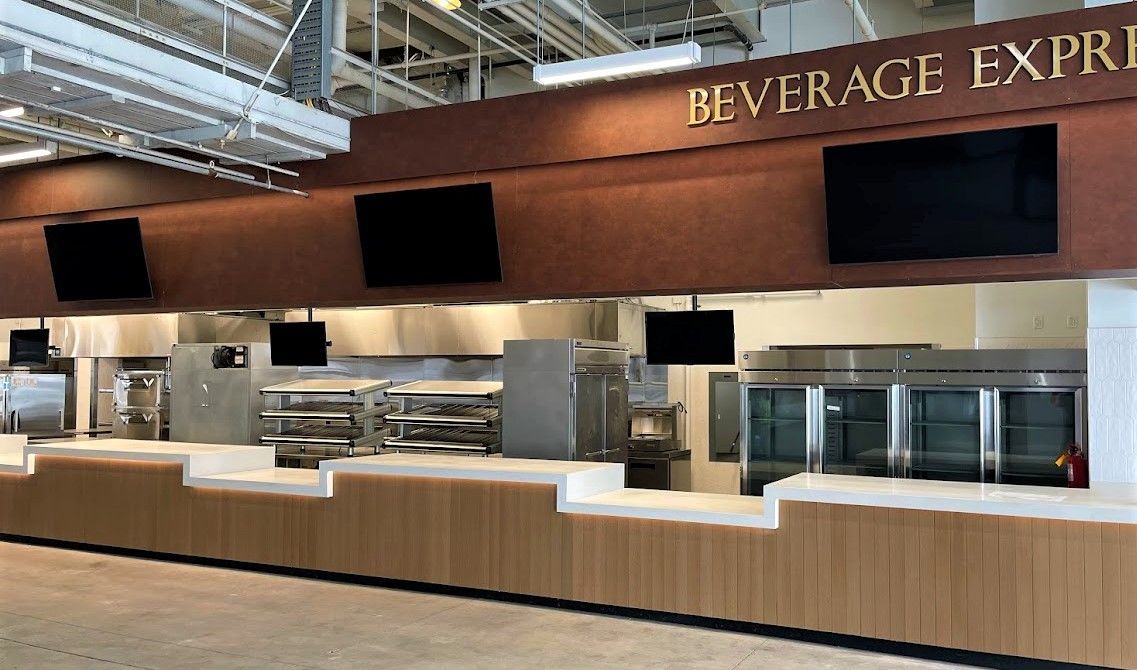 A modern, empty food service counter labeled 