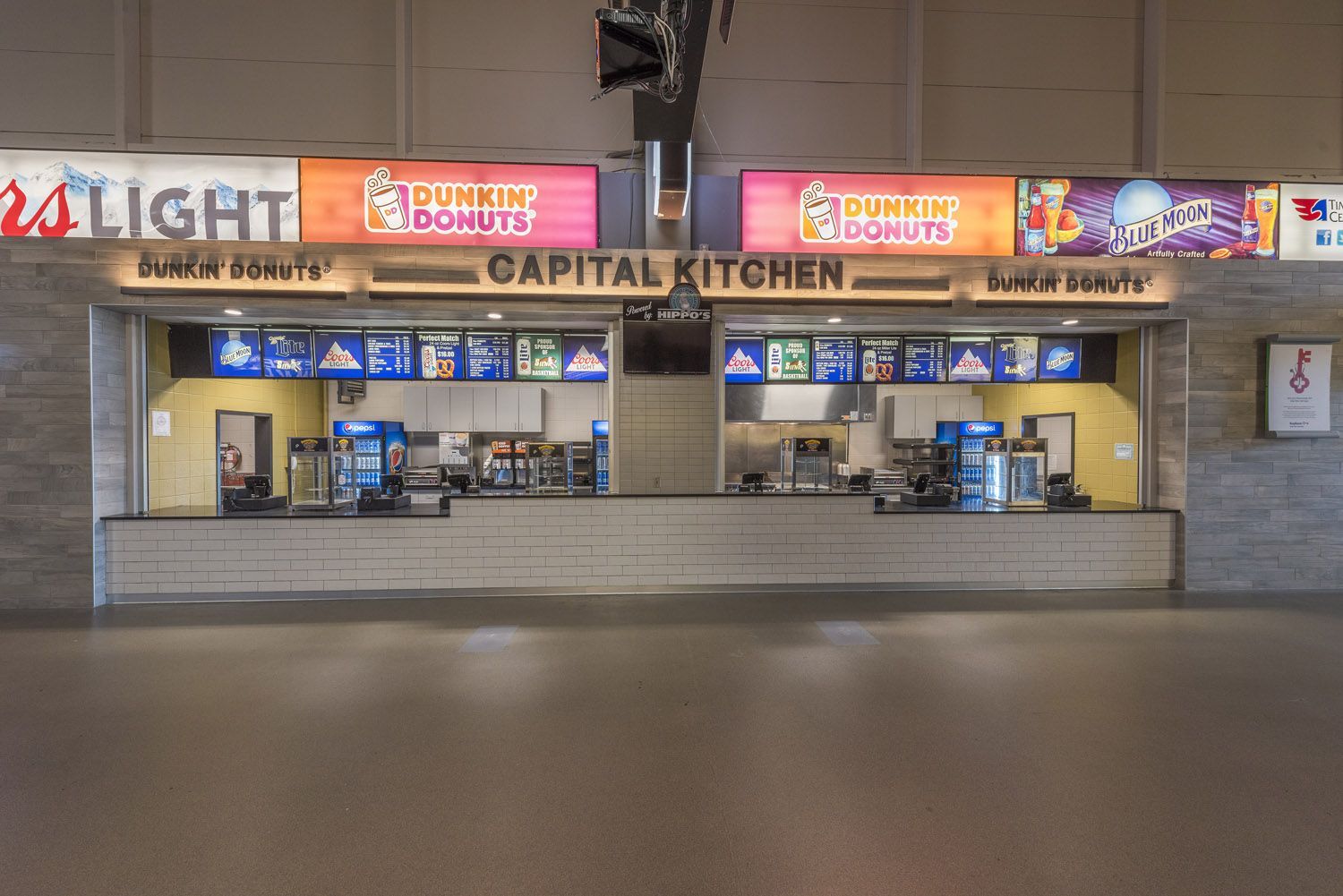 A wide view of a food concession stand labeled 