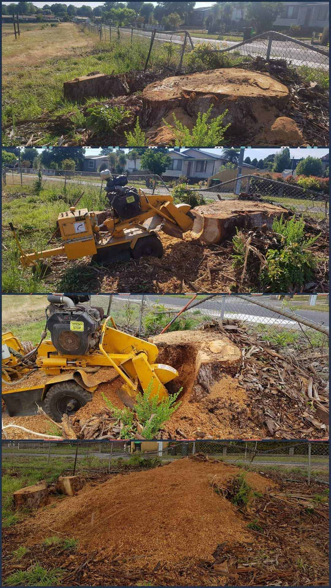 Yellow excavator clearing a large tree stump and debris in a rural yard, with a pile of wood chips nearby