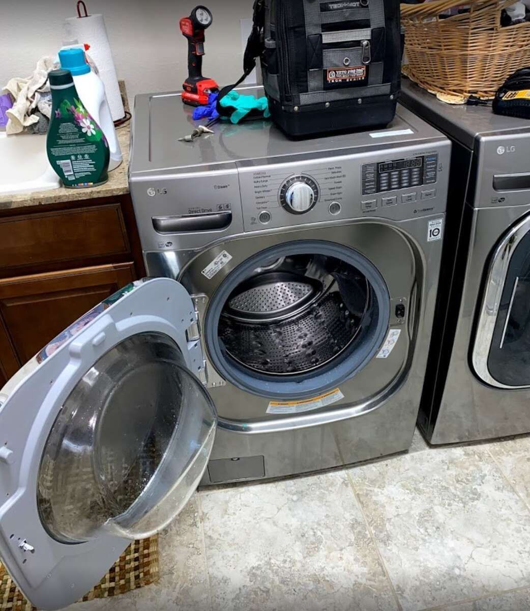 a washer and dryer in a laundry room with the door open