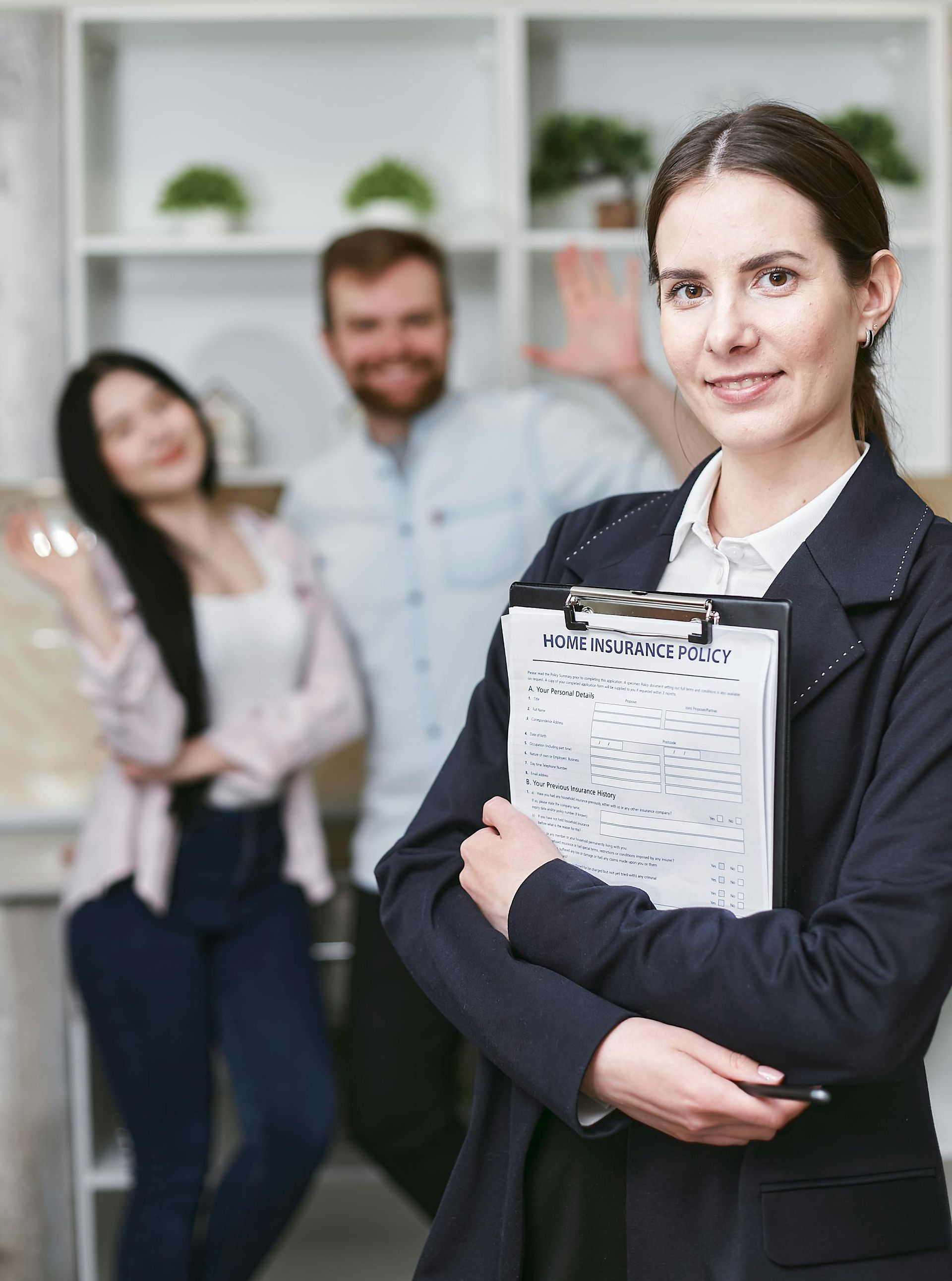 Smiling clients with a real estate agent, showcasing reliable and trusted industry members.