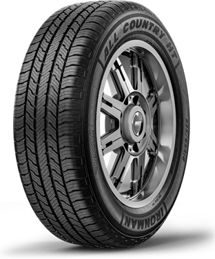 Black all-terrain tire mounted on a silver alloy wheel, isolated on a white background