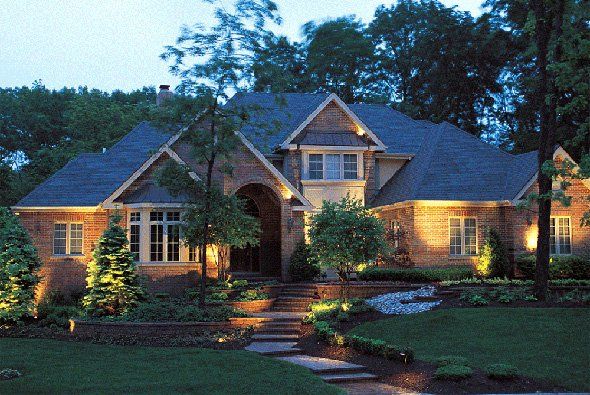 House with nice lighting — Clarkston, MI — Lowries Landscape Inc