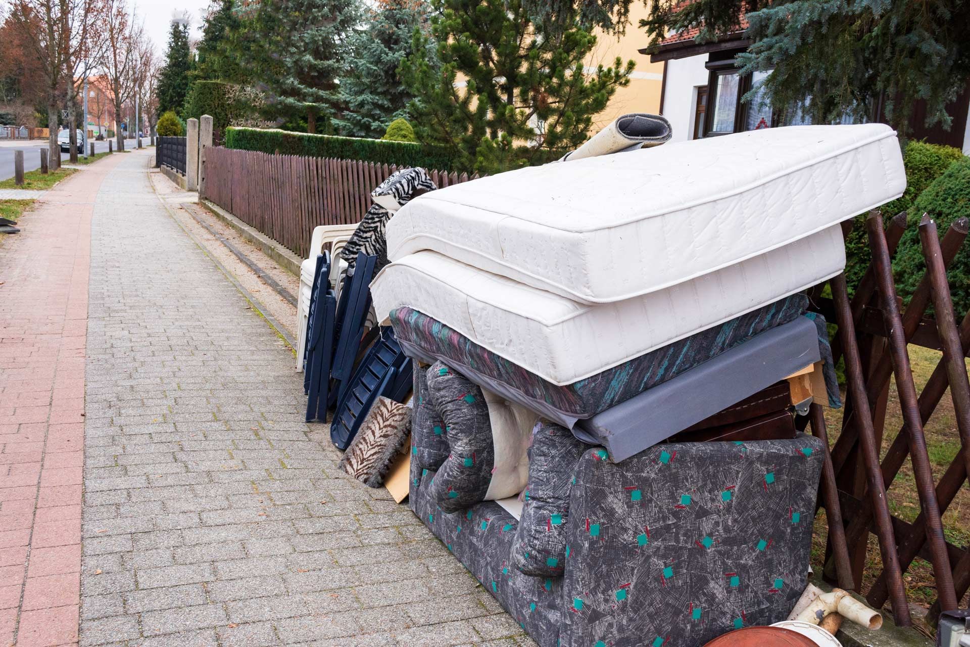 Mattresses and Furniture Outside the House