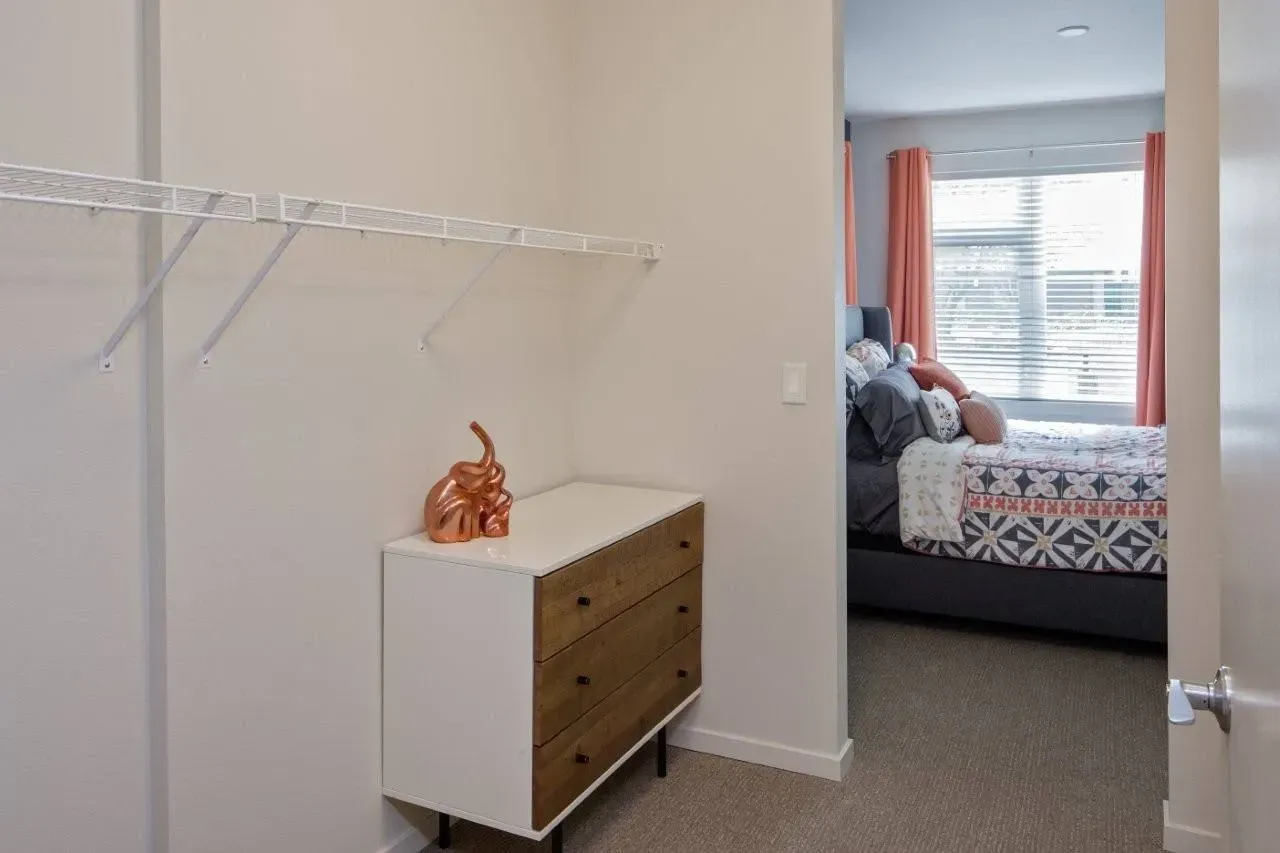 Bedroom with a dresser and closet