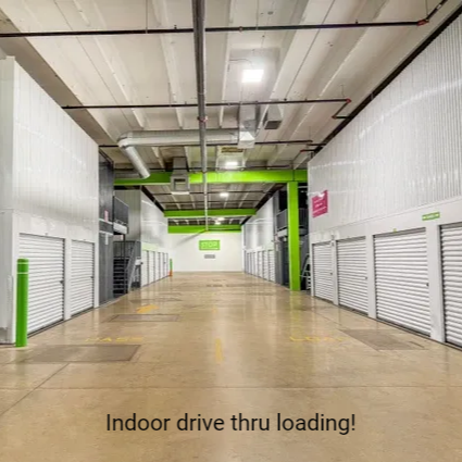 indoor hallway lined with garage-style doors