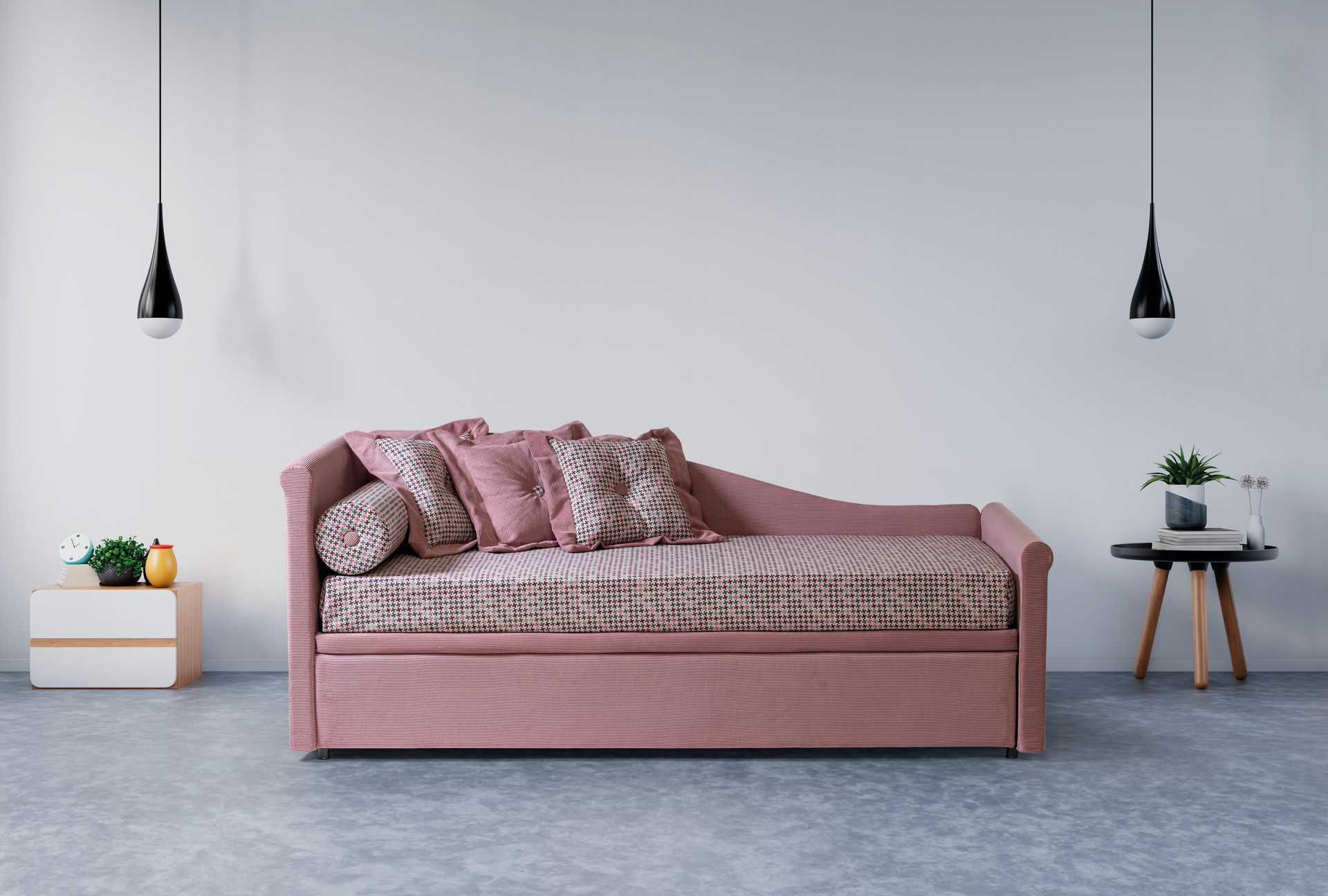 Un divano letto rosa è posizionato nel soggiorno accanto a un tavolo.
