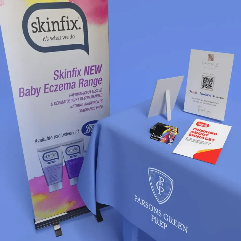 Table display for Skinfix Baby Eczema Range and Parsons Green Prep; featuring promotional materials and table cover.