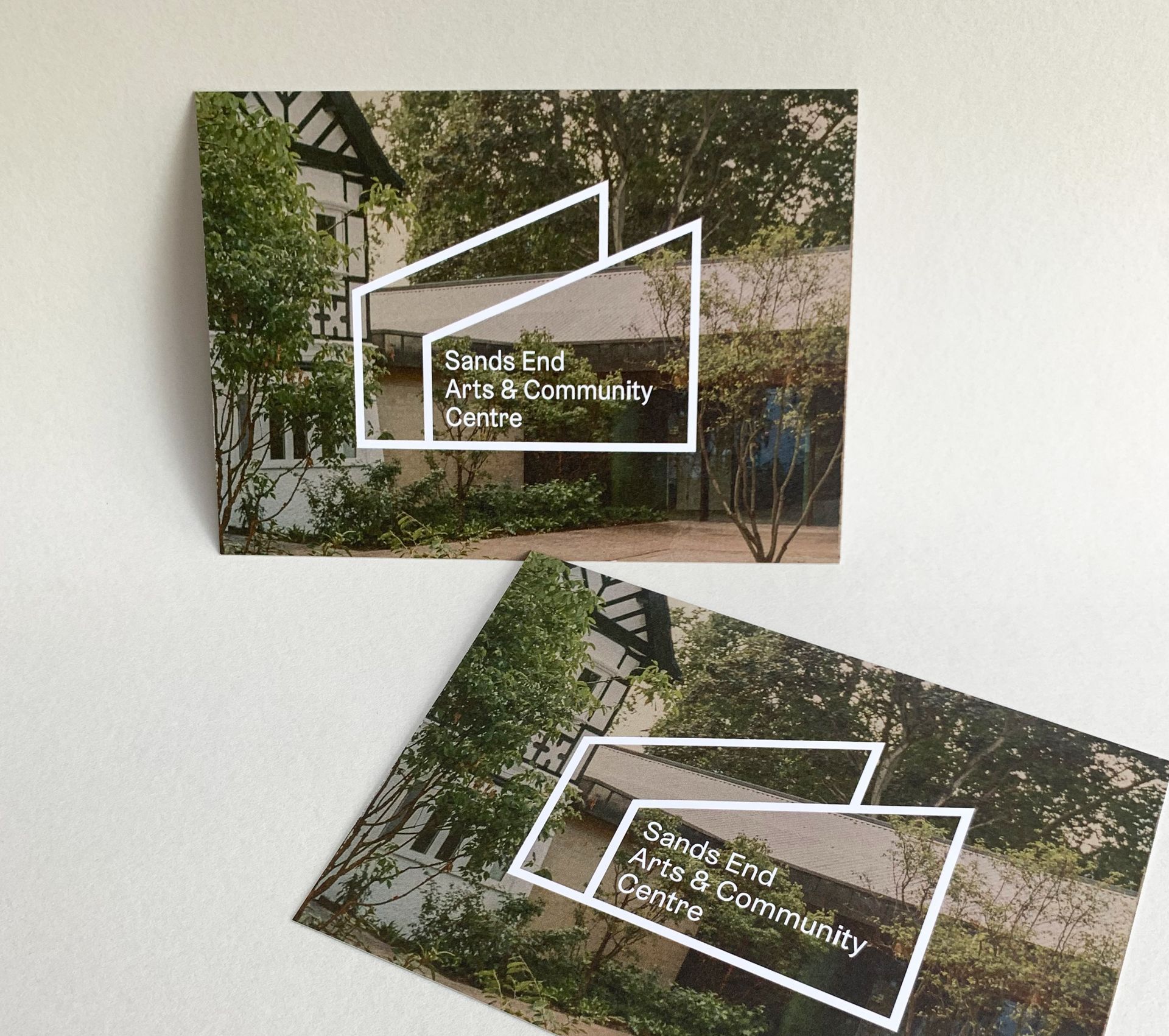 Two cards with the "Sanderstead Arts & Community Centre" logo overlayed on a photo of the building.
