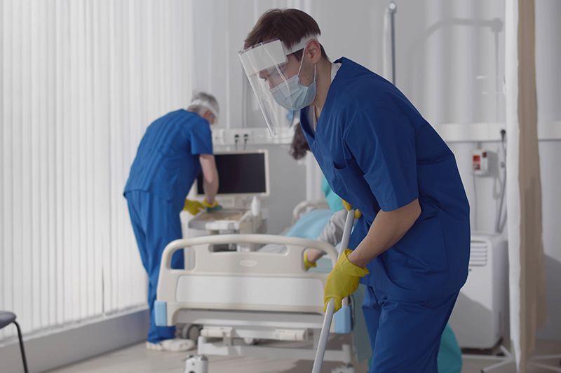Cleaners Cleaning The Hospital Room