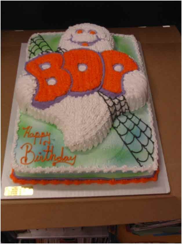 Halloween-themed cake; white ghost says 