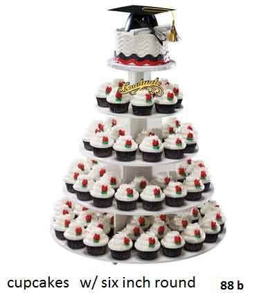 Graduation cupcake tower with a mini cake topper and red and white cupcakes.