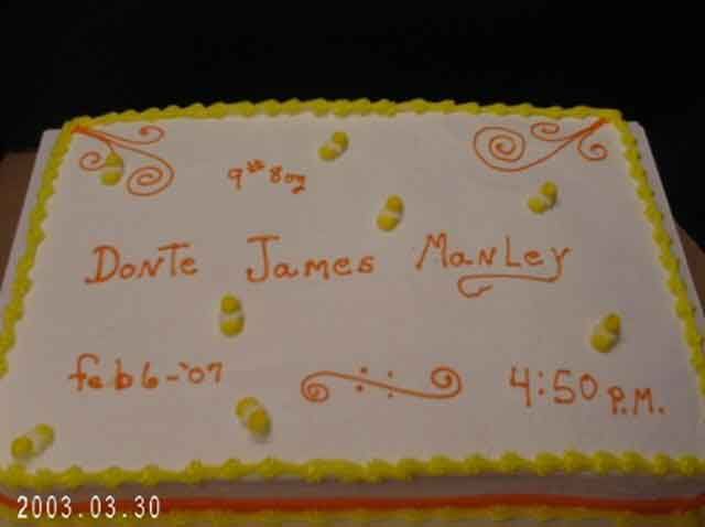 Rectangular cake with yellow border, white icing, and orange writing: 