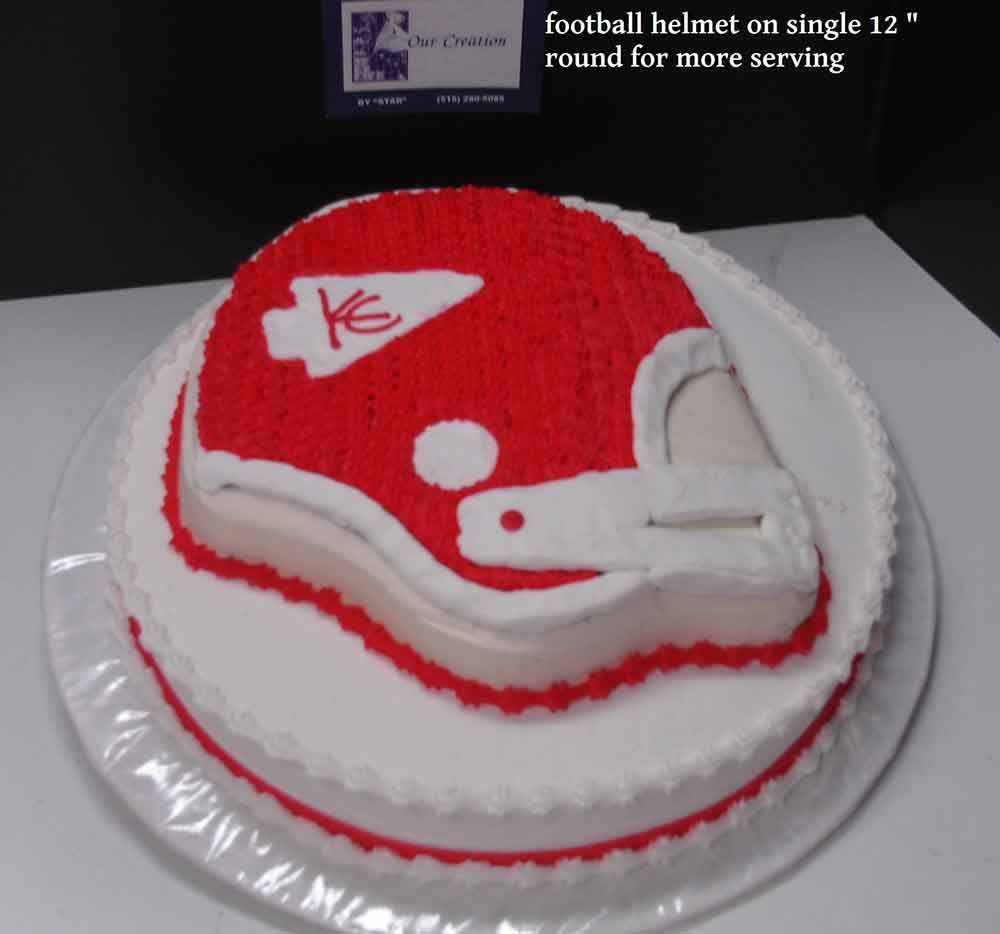 Cake decorated as a Kansas City Chiefs football helmet on a white round cake.