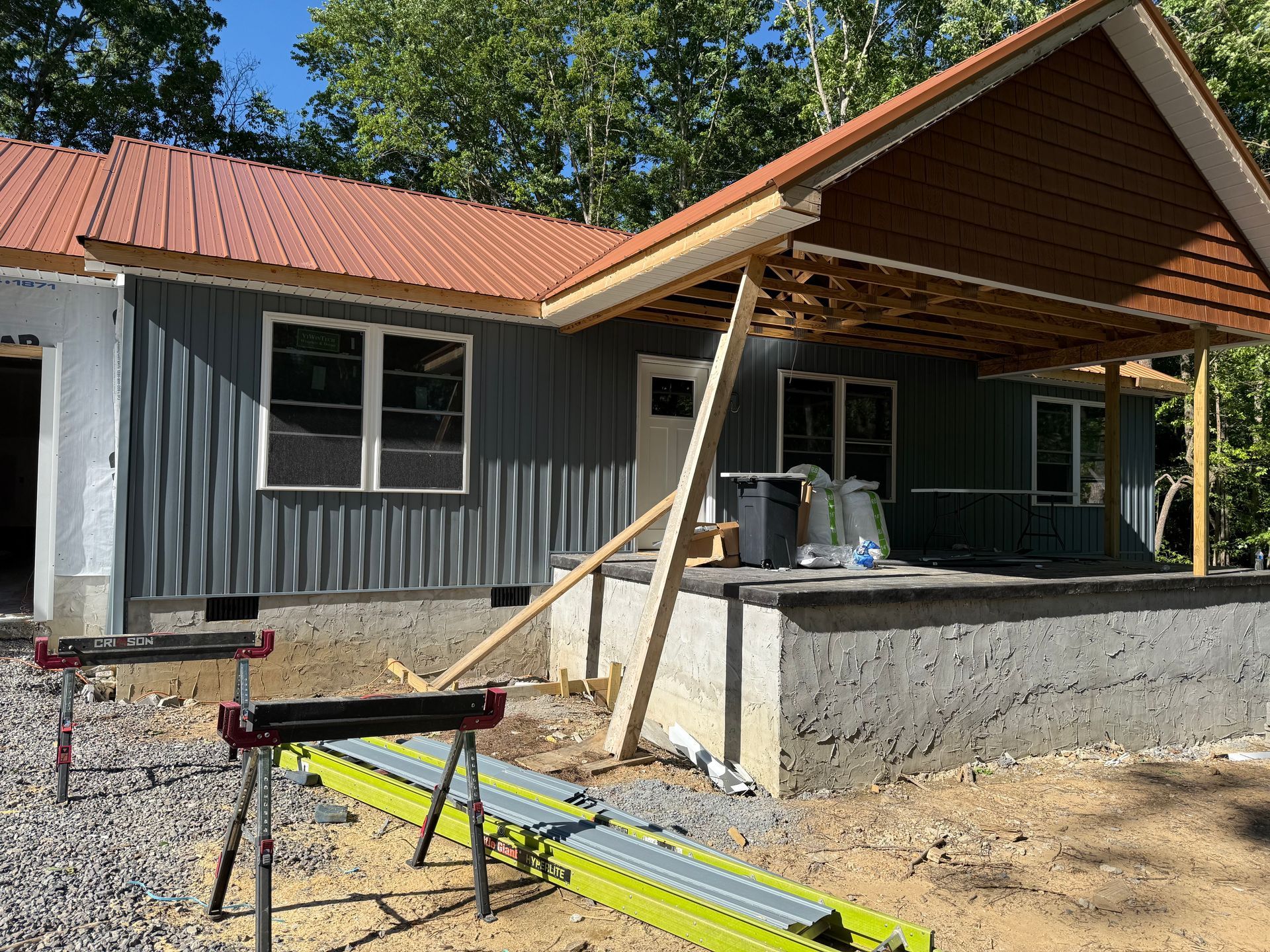 A house is being built with a lot of windows and a roof
