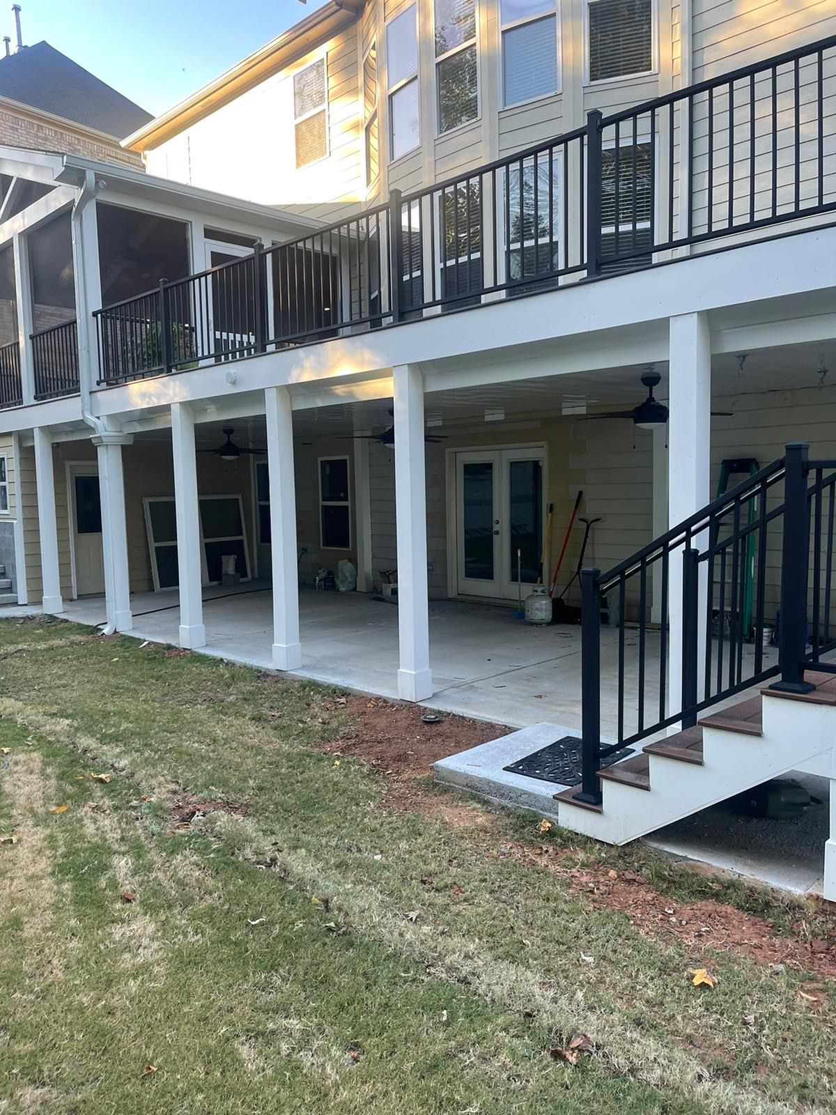 There is a large deck with stairs leading up to it.