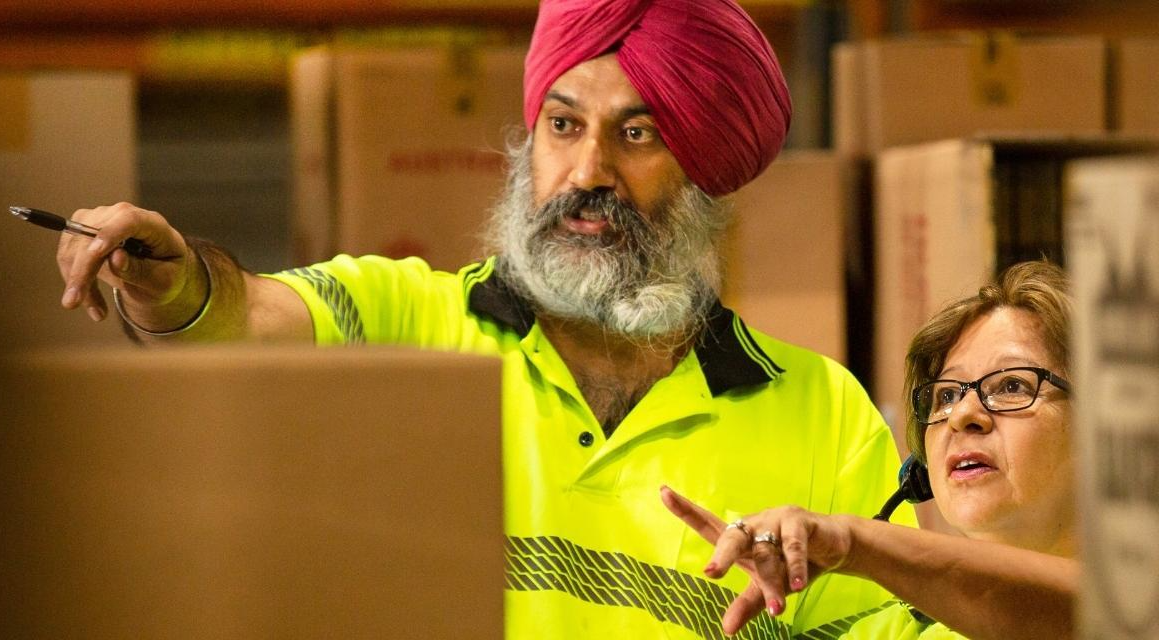 Two warehouse workers