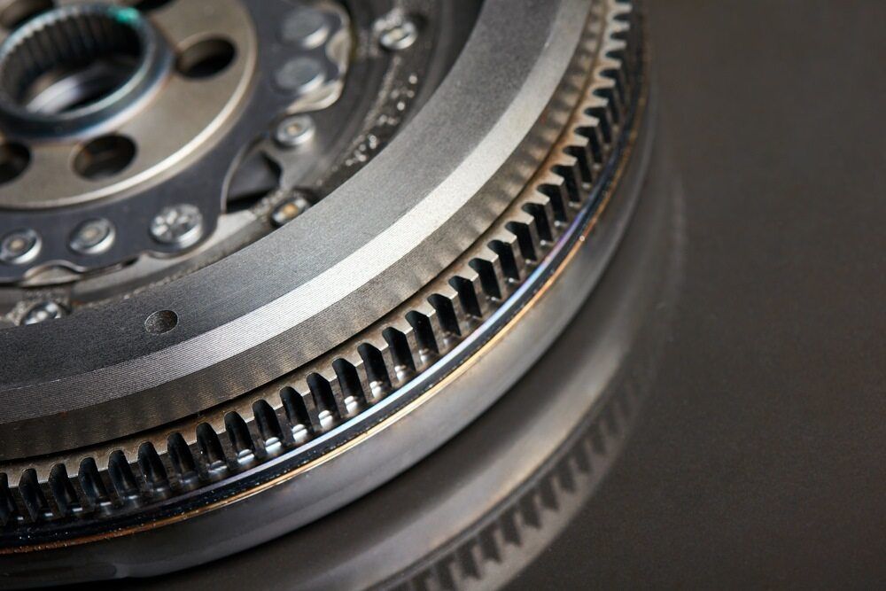 A Close Up Of A Metal Gear On A Black Surface — All Engine Repairs in South Murwillumbah, NSW