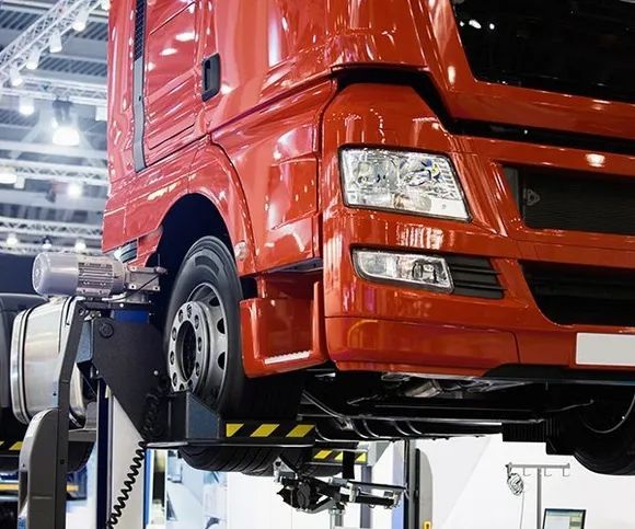 Front View Of Red Truck Sitting On A Lift — All Engine Repairs in South Murwillumbah, NSW