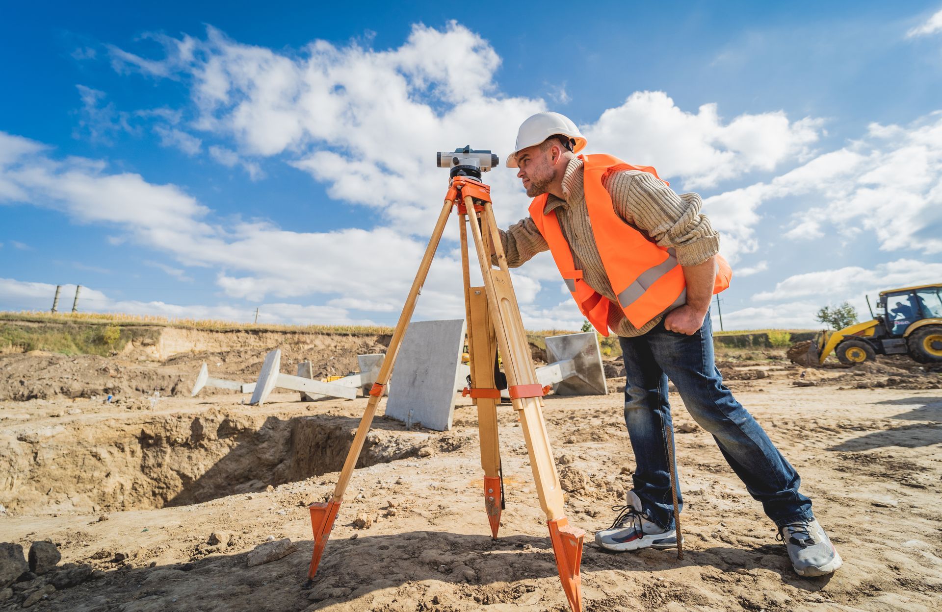 Construction team in hard hats and safety vests discussing plans at a building site. Construction team in hard hats and safety vests discussing plans at a building site.