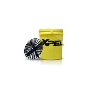 Yellow XPEL bucket with a black circular grille leaning against it on a white background
