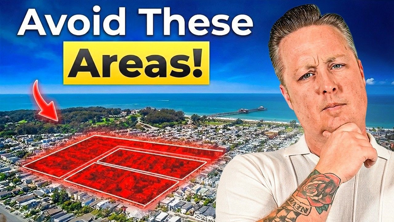 A man in a white shirt with a tattooed arm looks thoughtful next to a highlighted red area on a coastal neighborhood map.
