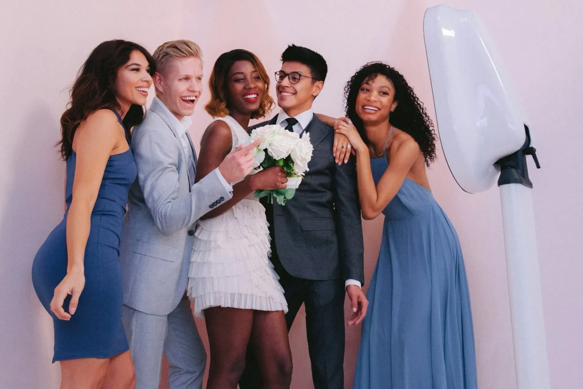 Wedding party in formal attire posing at a luxury wedding photo booth rental in Maryland