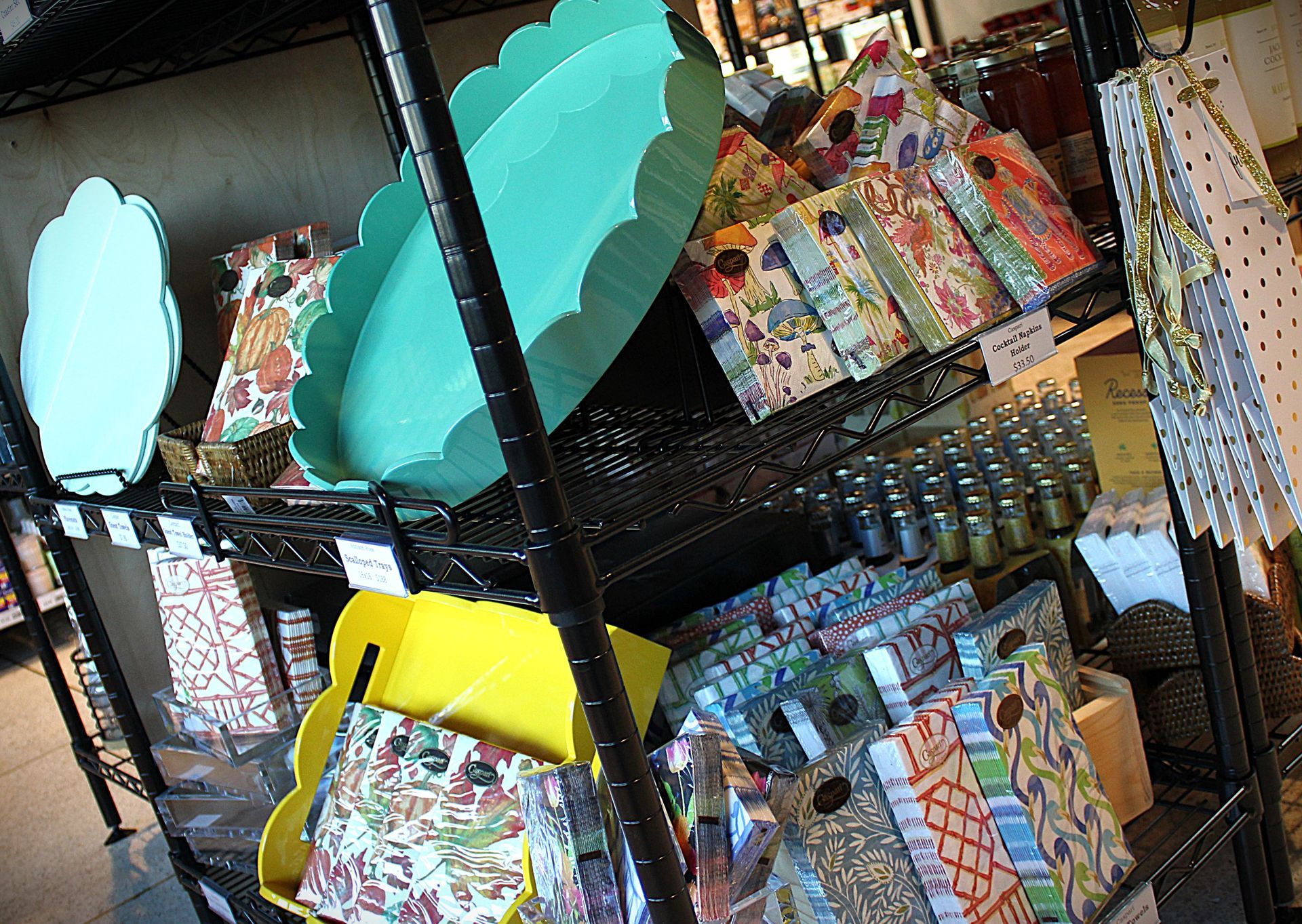 A shelf filled with a variety of items including plates and bags