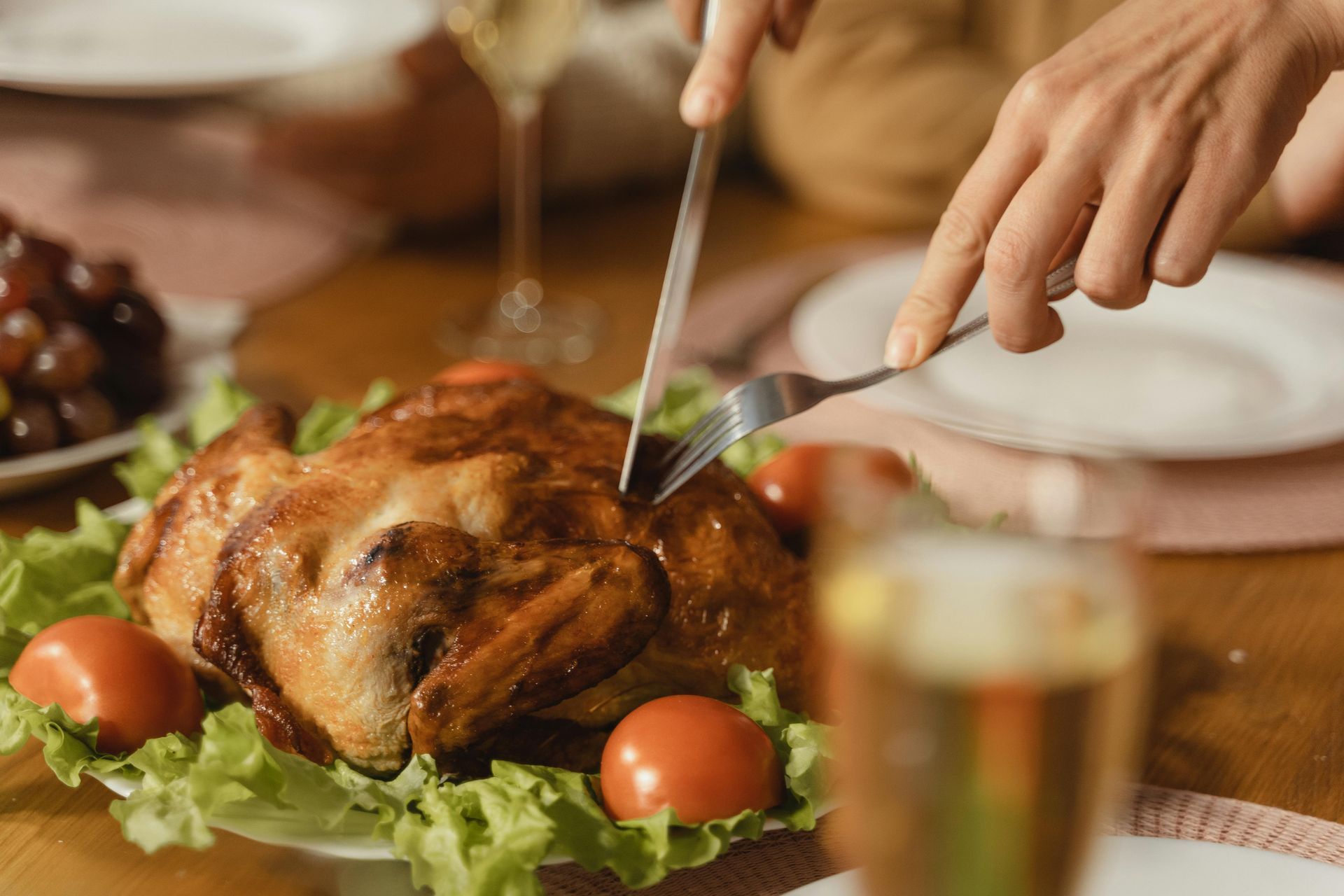 Person cutting into a roast turkey