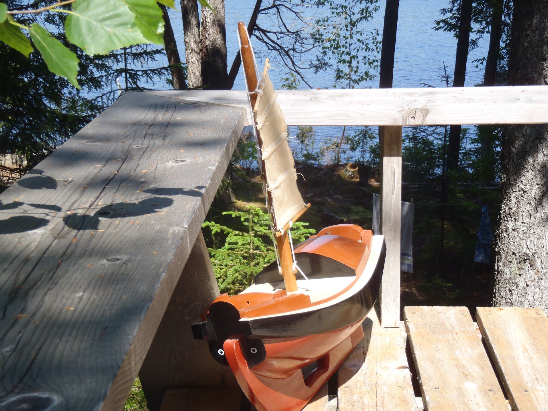 Chinese Junk handmade cedar wood boat personal floatation device for swimmer showing oculus detail.
