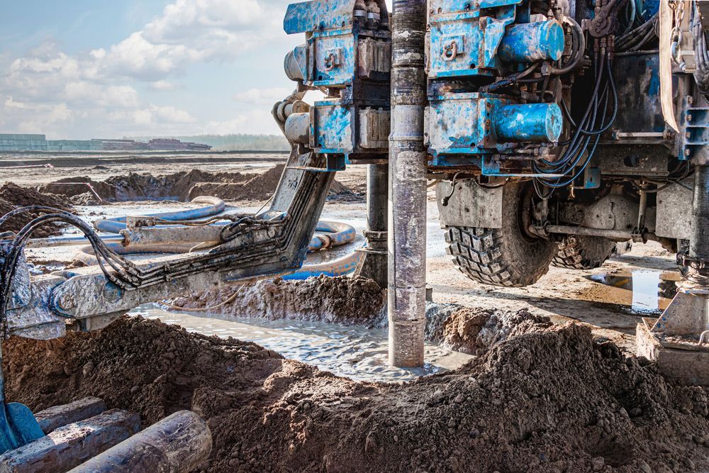 A large machine is drilling a hole in the ground.