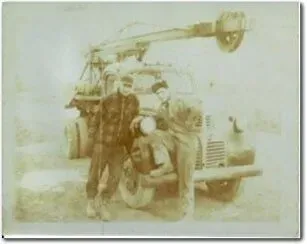 A group of people are posing for a picture in front of a jeep.